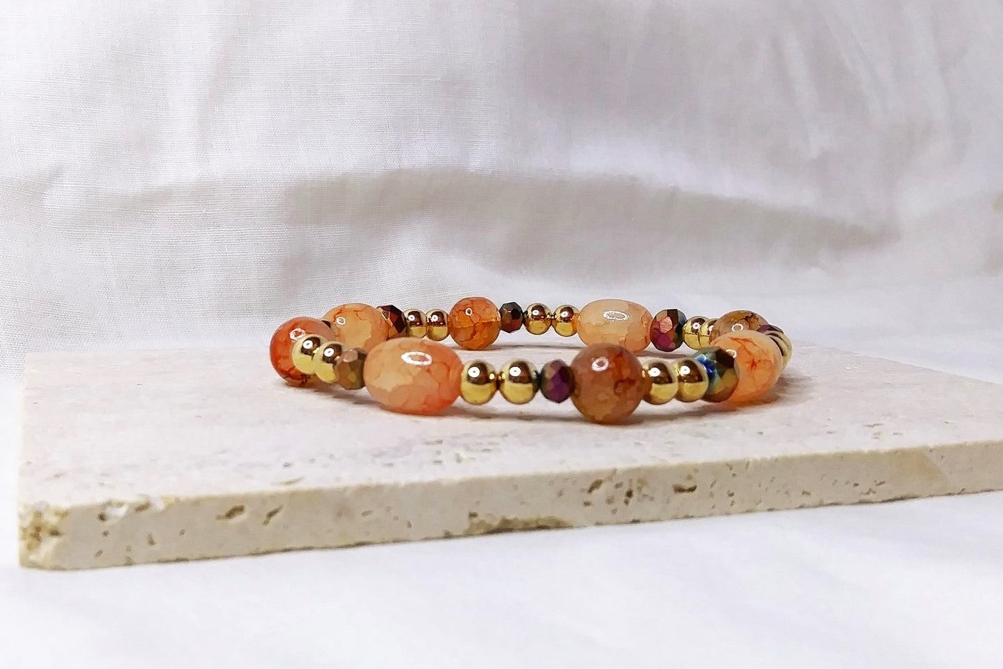 Gold & peach colored beaded stretch bracelet