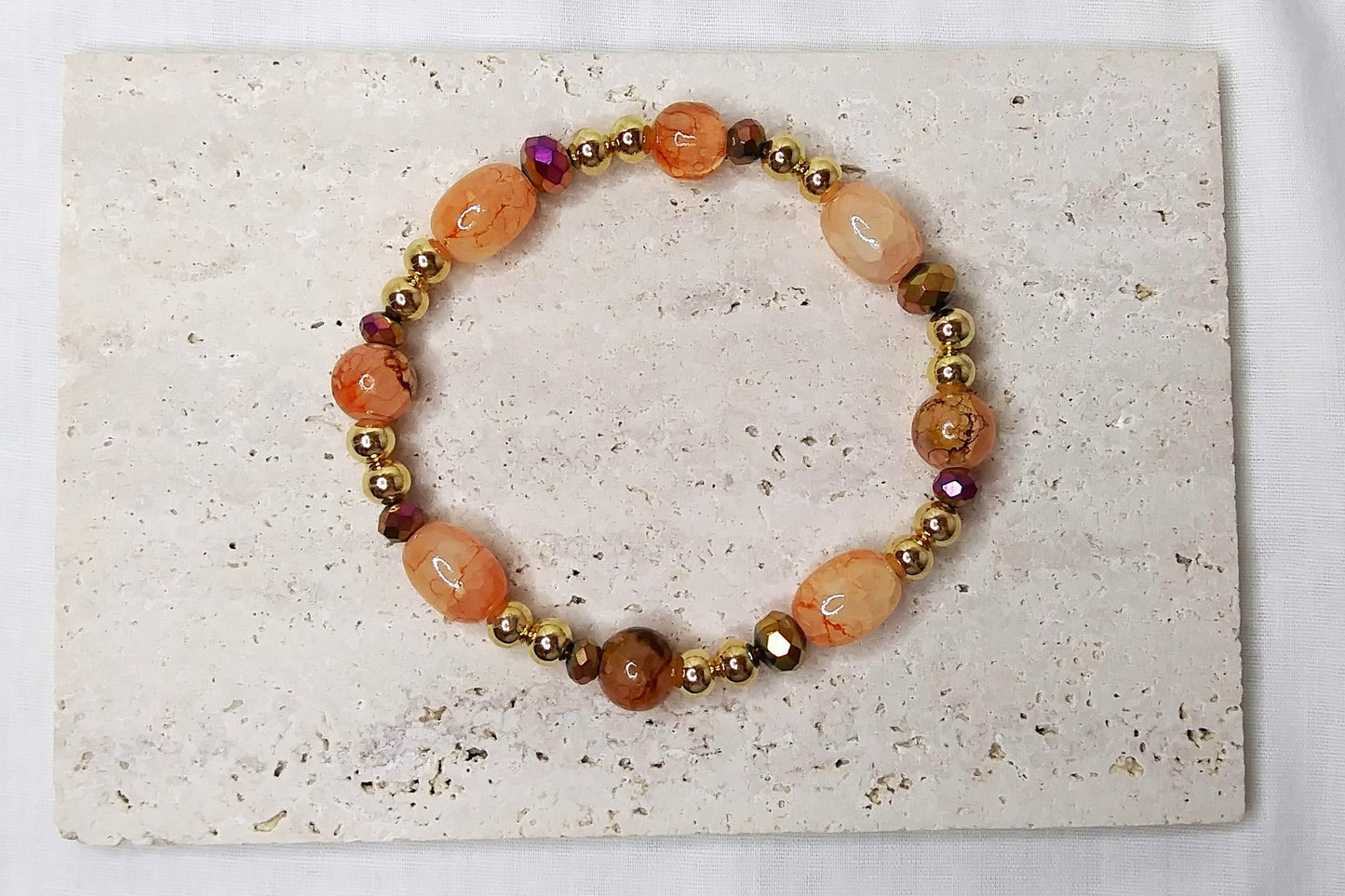 Gold & peach colored beaded stretch bracelet