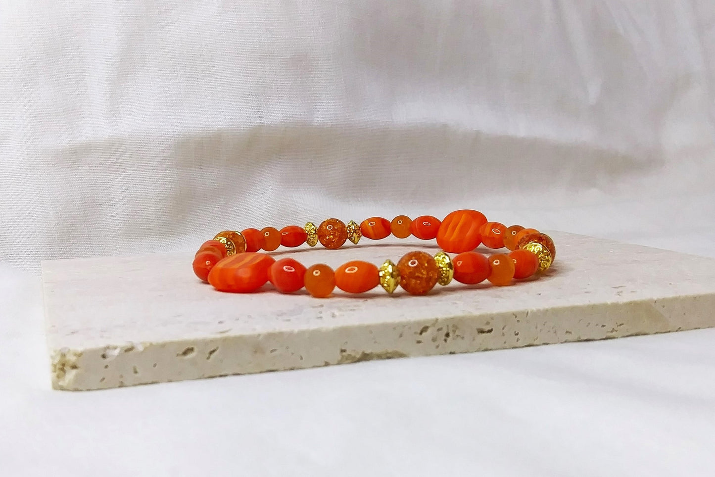 Glass beads and Orange Quartz with gold accent stretch stackable bracelet