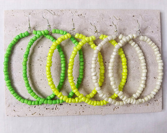 Different color oval shaped beaded hoop earrings