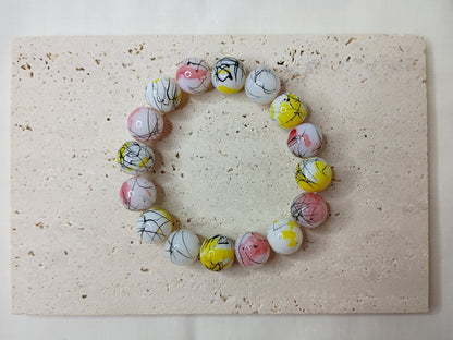 colorful beaded bracelet, handmade jewelry, artsy bracelet, splatter paint beads, bold statement jewelry