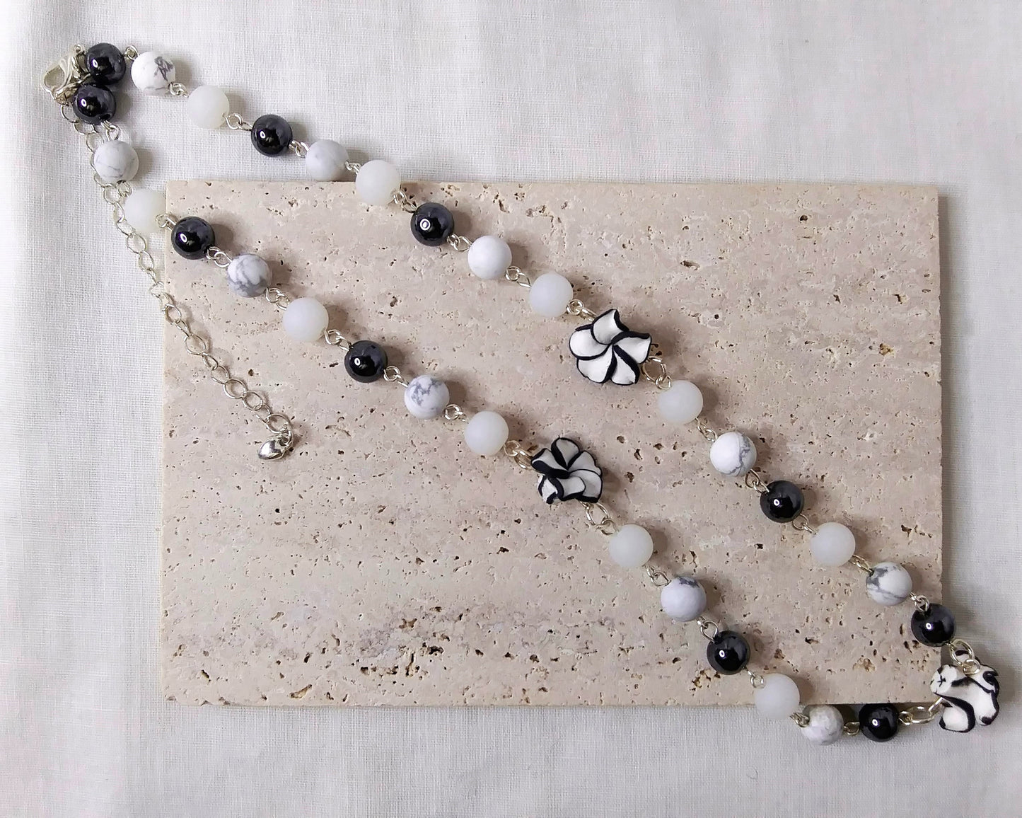 Gemstone Necklace, Silver Necklace, Hematite, howlite, white glass beads. Poly clay flower shape beads
