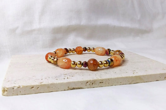 Gold & peach colored beaded stretch bracelet