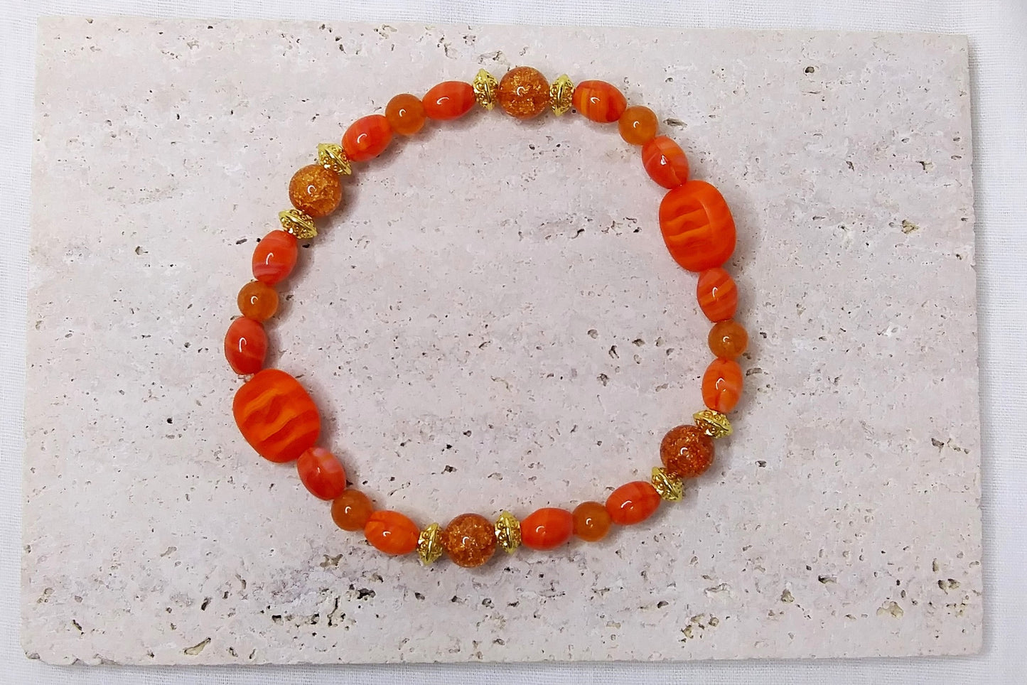 Glass beads and Orange Quartz with gold accent stretch stackable bracelet