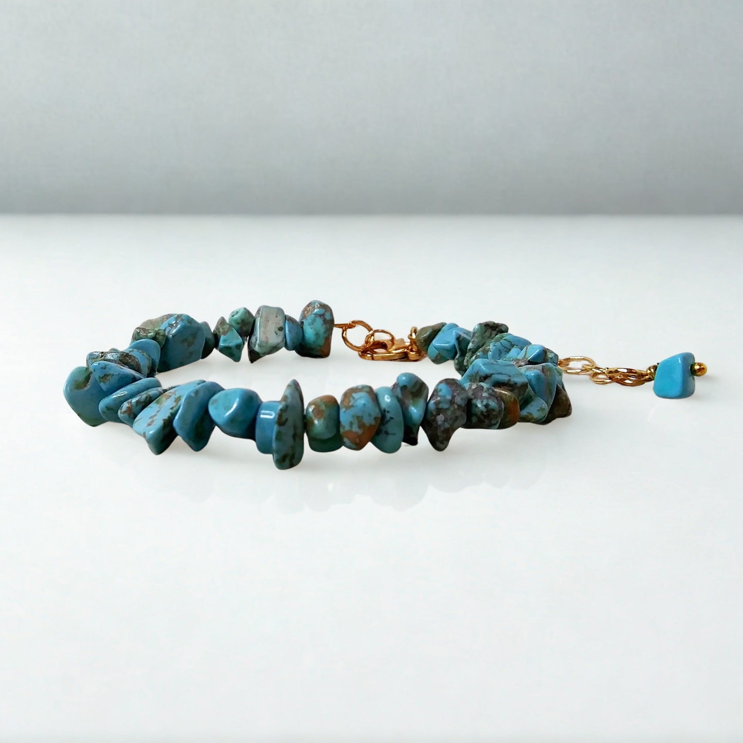 Turquoise beaded bracelet on a white background