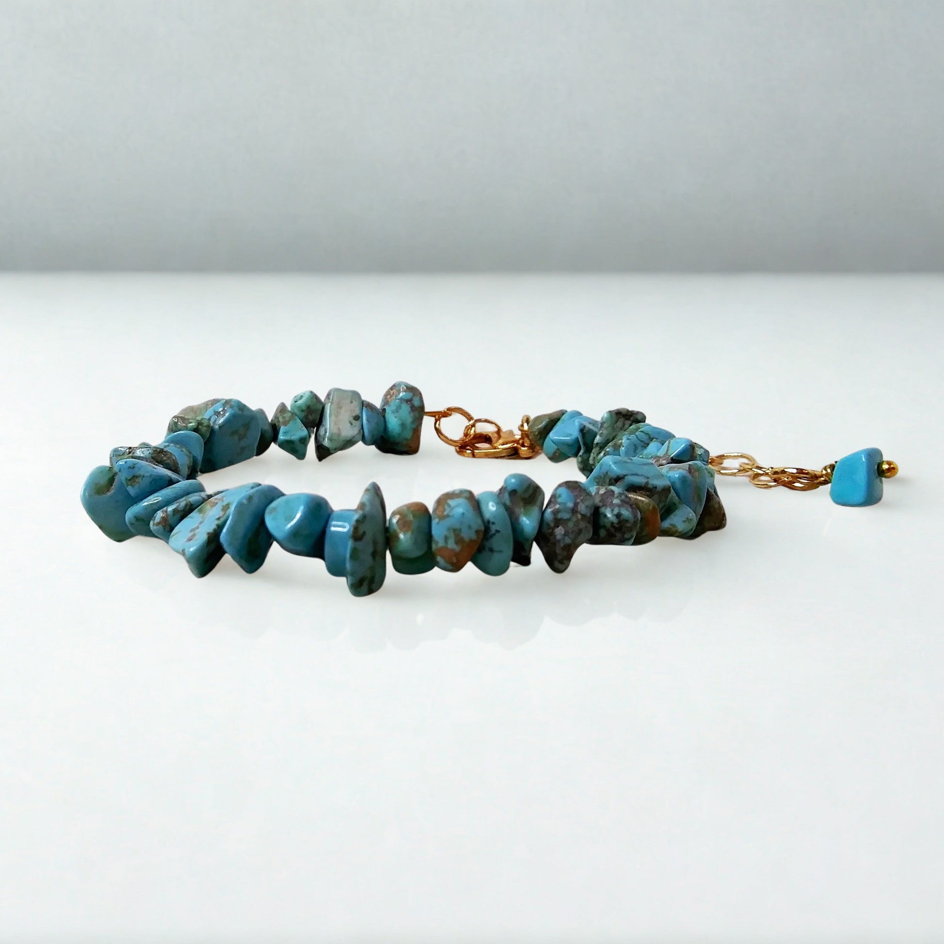 Turquoise beaded bracelet on a white background