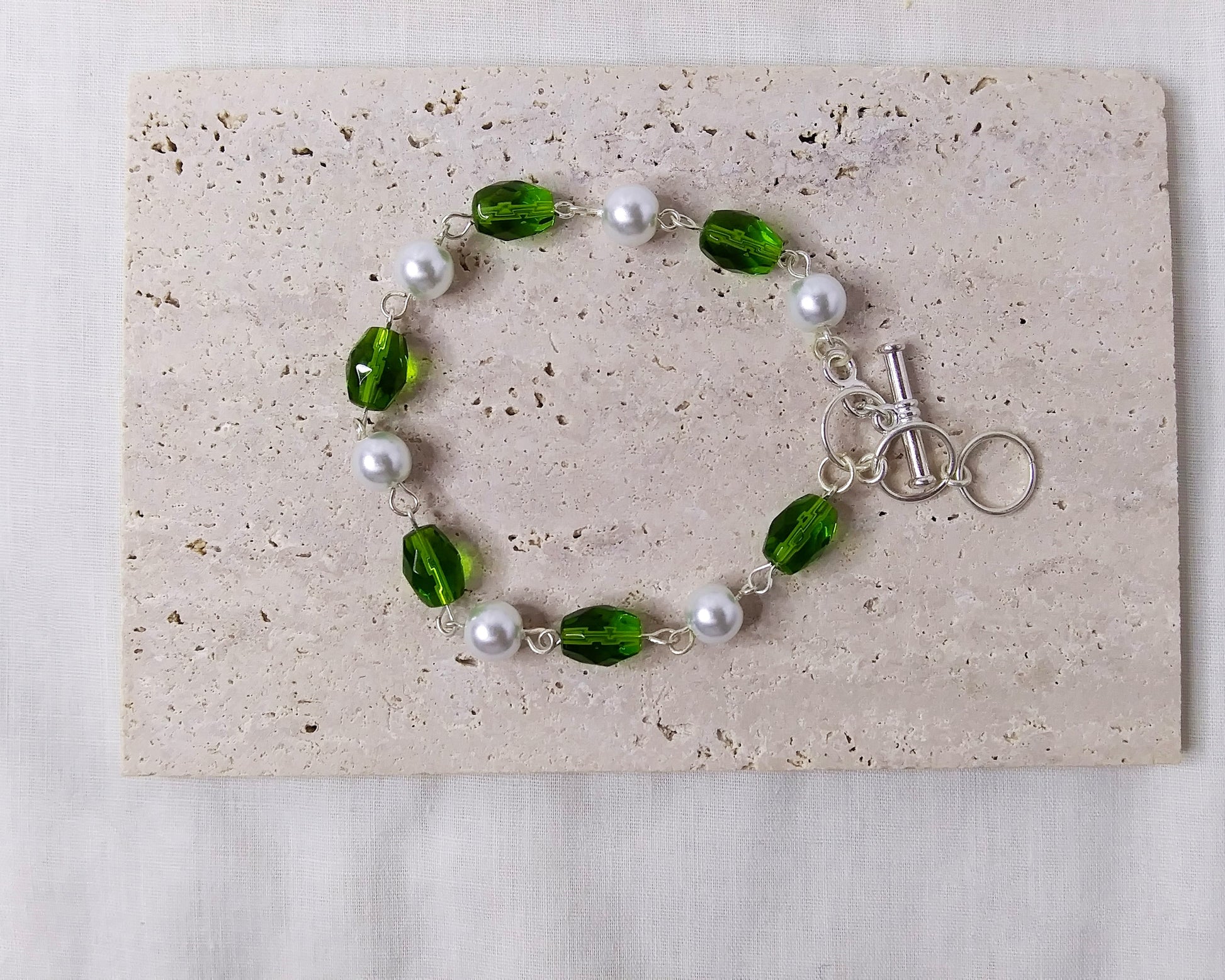 green white and silver beaded bracelet with toggle clasp