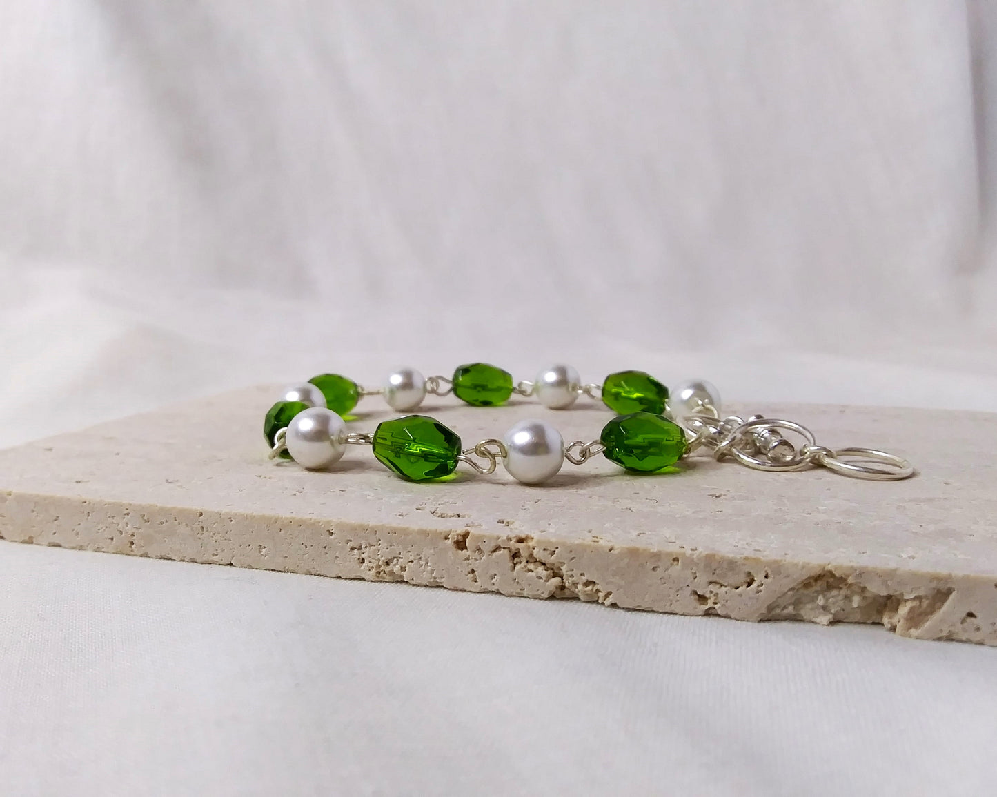 green white and silver beaded bracelet with toggle clasp