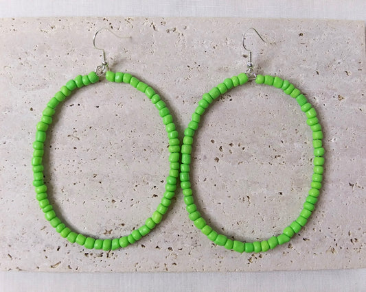 Different color oval shaped beaded hoop earrings