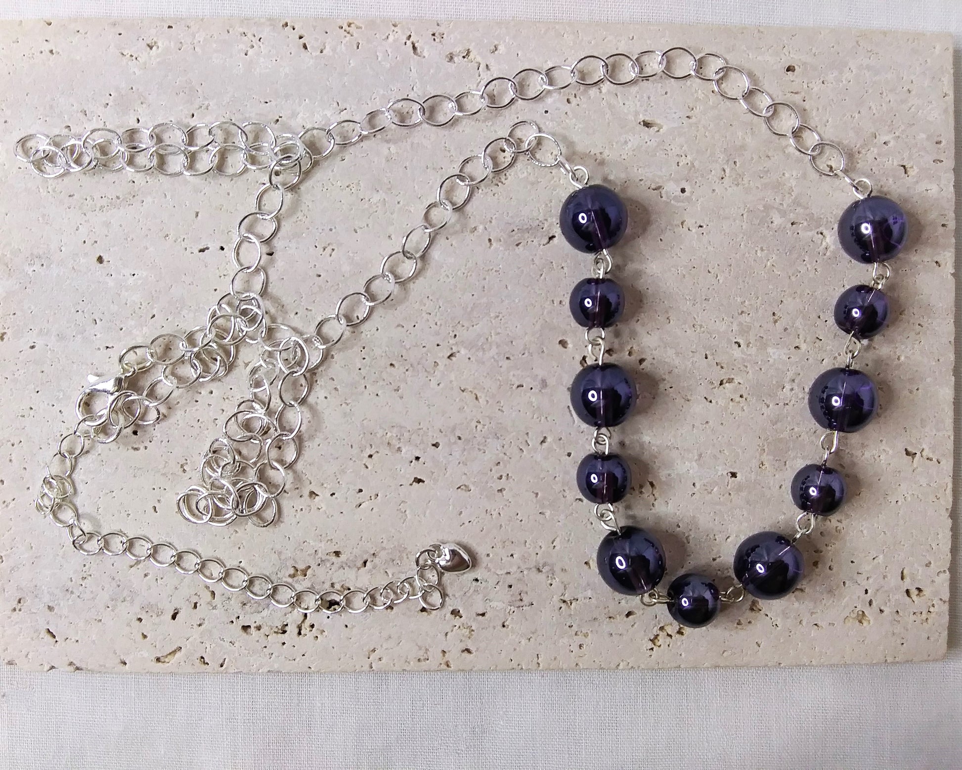 Long silver plated necklace with purple beads
